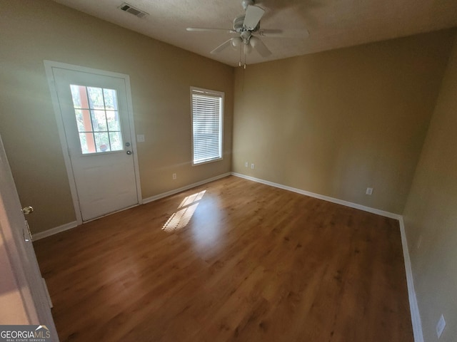 spare room featuring ceiling fan and wood-type flooring