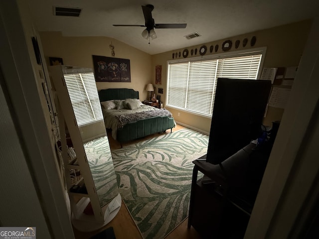 bedroom with ceiling fan and lofted ceiling