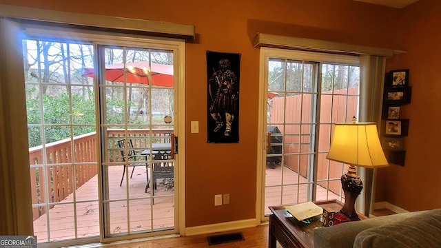 entryway with hardwood / wood-style flooring and a wealth of natural light