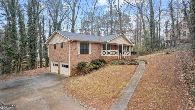 view of home's exterior with a porch and a garage