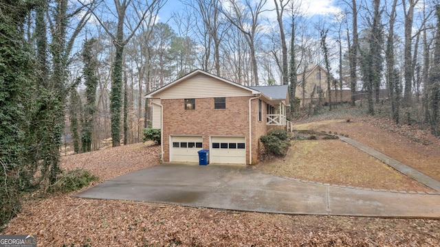 view of side of property with a garage