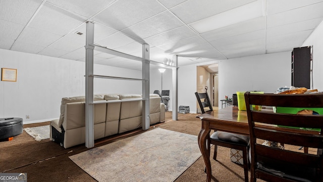 dining area with a paneled ceiling