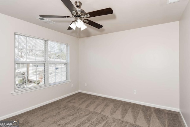 carpeted empty room featuring ceiling fan