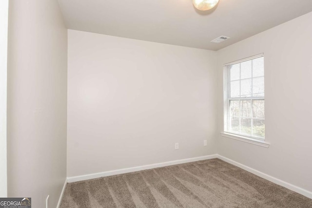 view of carpeted spare room