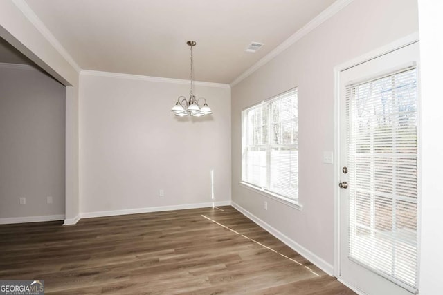 unfurnished dining area with a healthy amount of sunlight, ornamental molding, and dark hardwood / wood-style floors