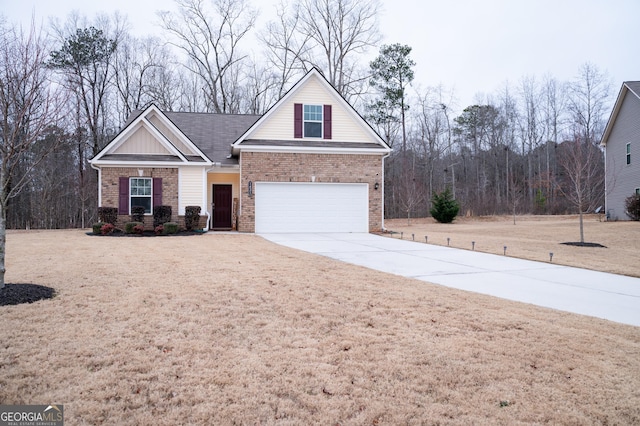 view of front of house with a garage and a front lawn