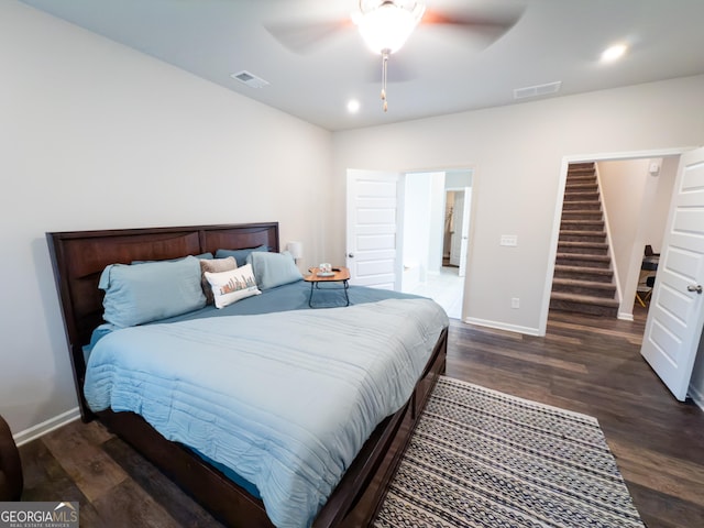 bedroom with dark wood-type flooring and ceiling fan