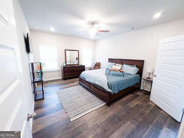 bedroom featuring dark hardwood / wood-style flooring and ceiling fan