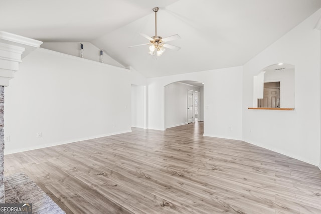 unfurnished living room featuring high vaulted ceiling, ceiling fan, and light wood-type flooring