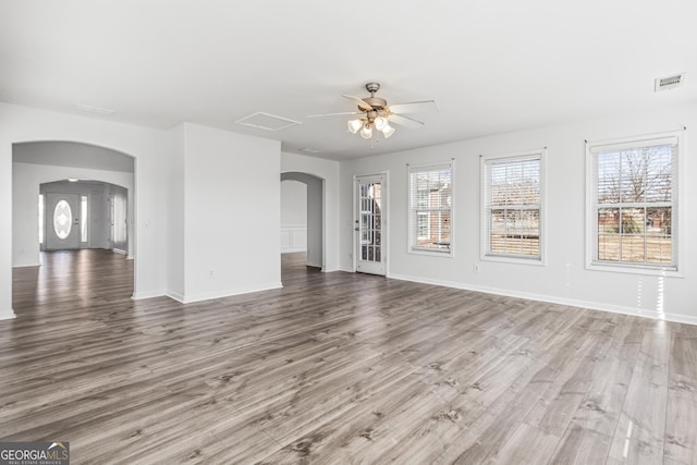 interior space featuring wood-type flooring and ceiling fan