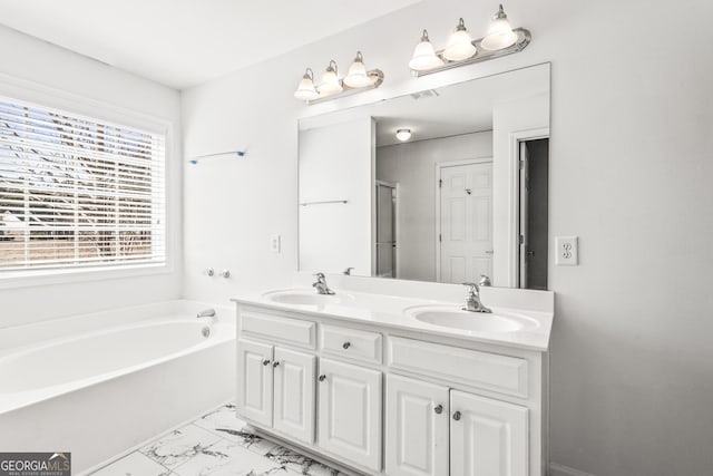 bathroom with a tub to relax in and vanity