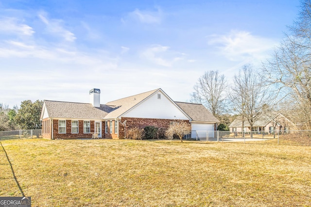 ranch-style home with a garage and a front yard