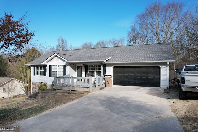 ranch-style home featuring a garage and covered porch