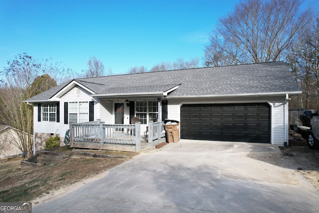 ranch-style home with a garage and covered porch