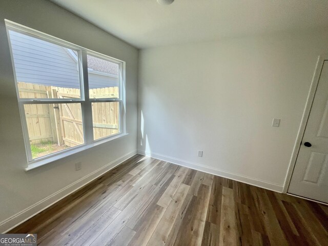 empty room featuring dark hardwood / wood-style floors