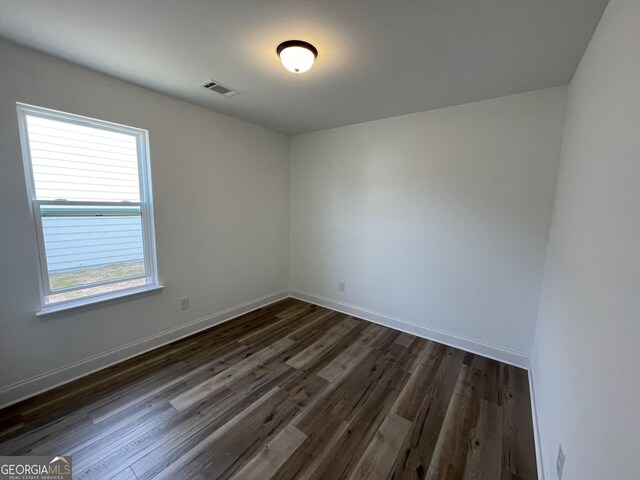 doorway to outside featuring hardwood / wood-style floors and ornamental molding