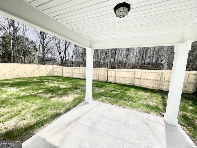 view of yard featuring a patio and a fenced backyard