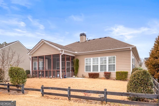 back of property featuring a sunroom