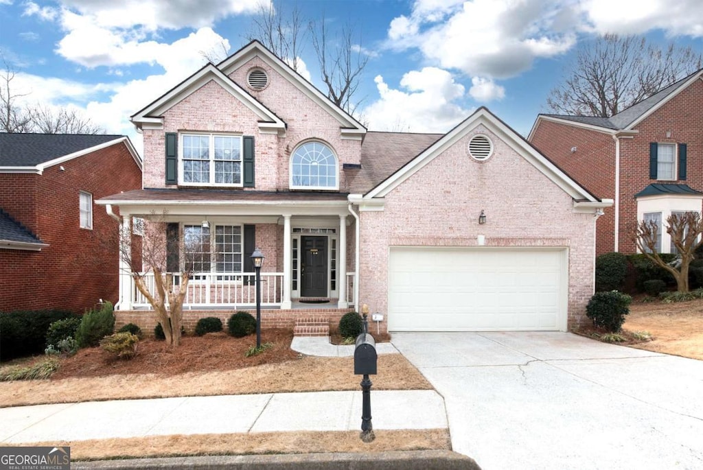 view of front of house with a garage and a porch