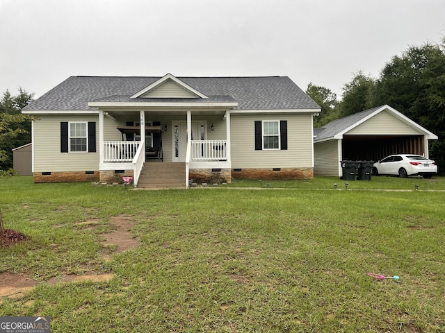 view of front of property featuring covered porch, a front lawn, and a carport