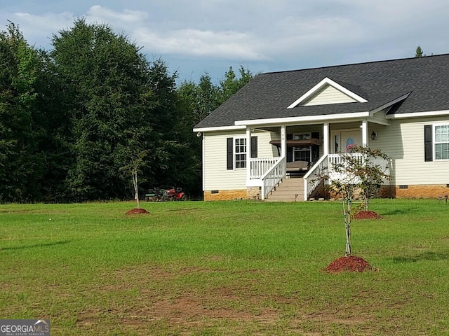 view of front of home featuring a front yard and a porch