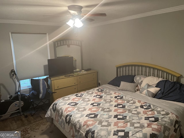 bedroom featuring ceiling fan, crown molding, and hardwood / wood-style floors