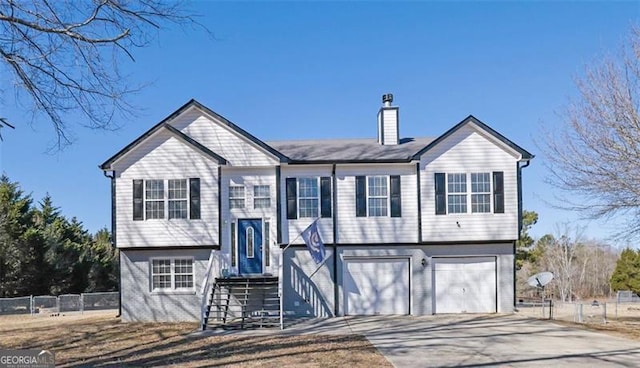 split foyer home featuring a garage