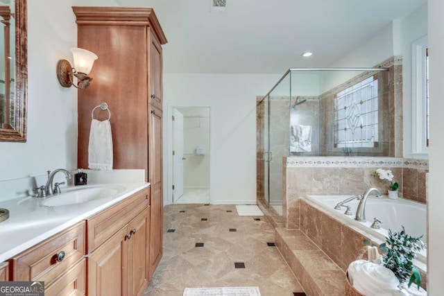 bathroom featuring vanity and plus walk in shower