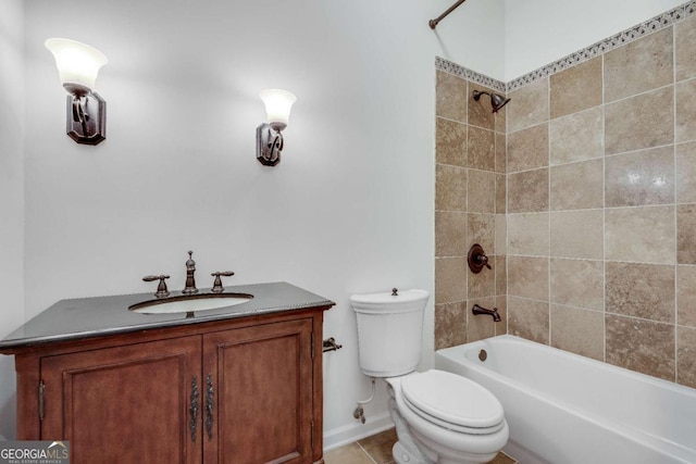 full bathroom with tiled shower / bath combo, vanity, tile patterned flooring, and toilet