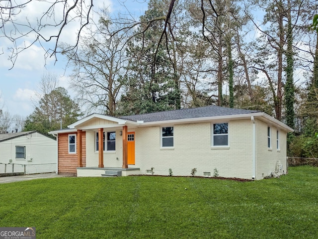 ranch-style house with crawl space, brick siding, a front lawn, and fence