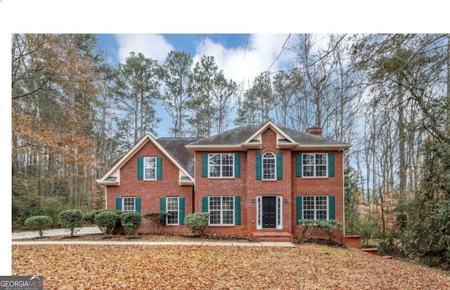 730 Pinehurst Dr, Fairburn, GA 30213 - colonial-style house with brick siding and a chimney