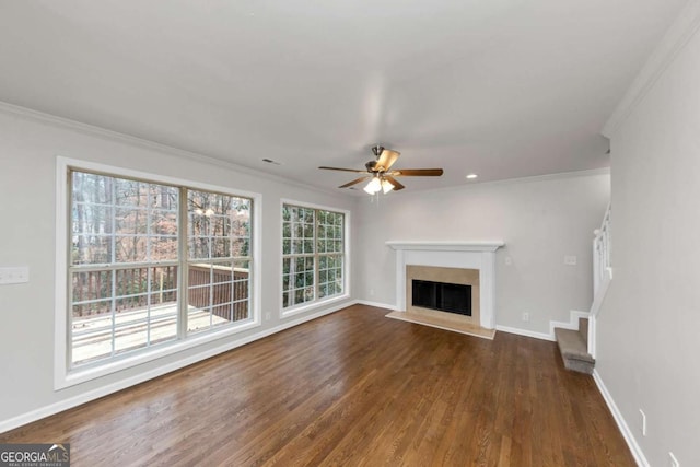 unfurnished living room with ceiling fan, dark hardwood / wood-style floors, and crown molding