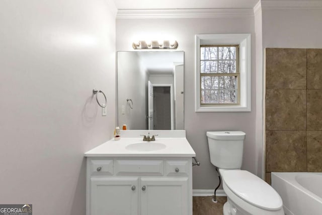 bathroom with a washtub, toilet, vanity, and ornamental molding