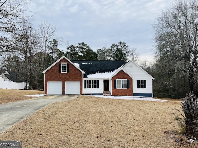 view of front of home with a garage and a front lawn