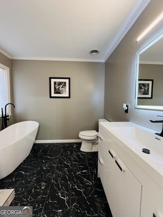 bathroom with a tub, crown molding, toilet, and vanity