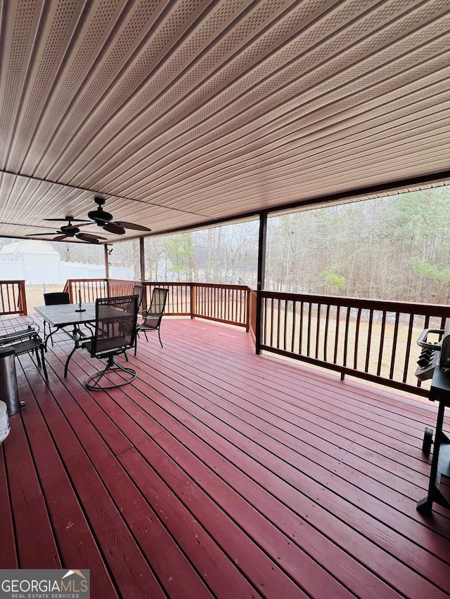 wooden terrace featuring ceiling fan