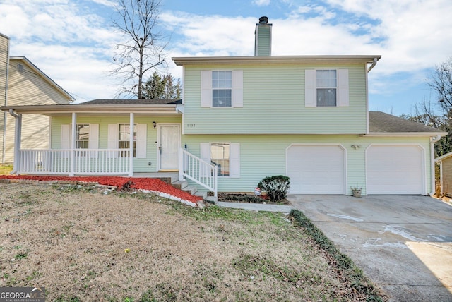 split level home featuring a front yard and covered porch