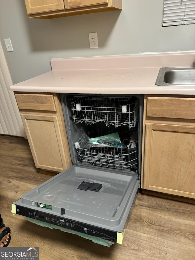 details with light brown cabinets and light wood-type flooring