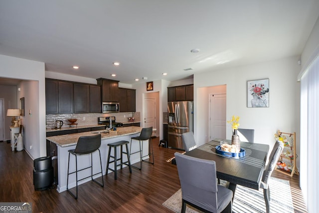 dining room featuring dark hardwood / wood-style flooring and sink