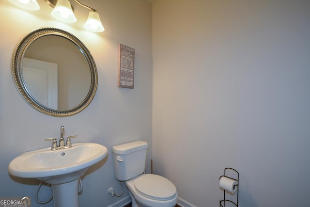 bathroom with sink and toilet