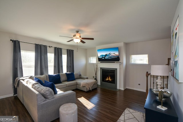 living room with dark hardwood / wood-style floors and ceiling fan