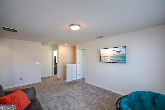 sitting room featuring carpet flooring