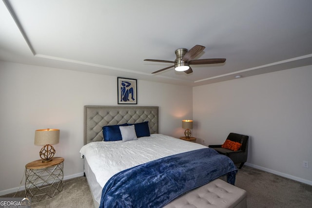 bedroom featuring ceiling fan and carpet