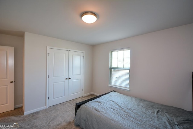 bedroom with a closet and carpet