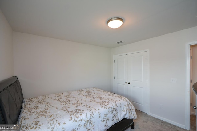 bedroom with a closet and carpet