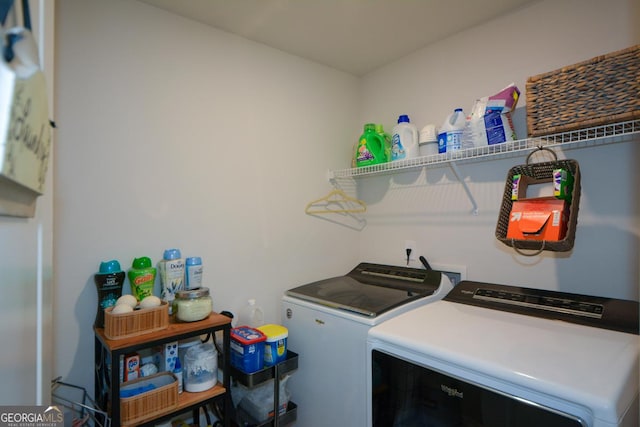 clothes washing area with washer and dryer