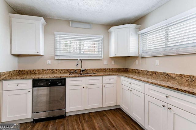 kitchen featuring sink, white cabinets, a textured ceiling, and dishwasher