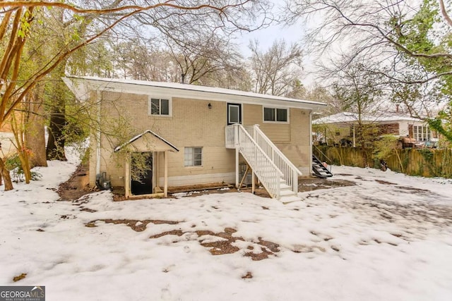 view of snow covered house