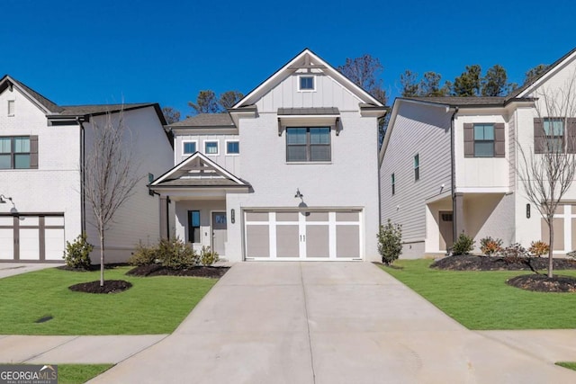 view of front of property featuring a garage and a front lawn