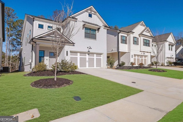 view of front facade with a garage, central air condition unit, and a front lawn